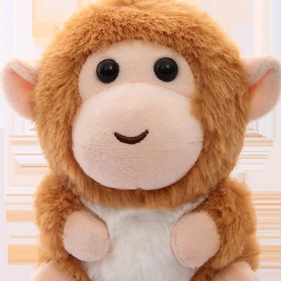 Nyckelring mjukisdjur apa i brun och beige färg med stort runt huvud och söta ögon